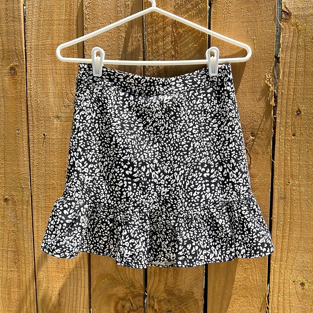 Black and white printed mini skirt with flounce hem and built-in shorts
